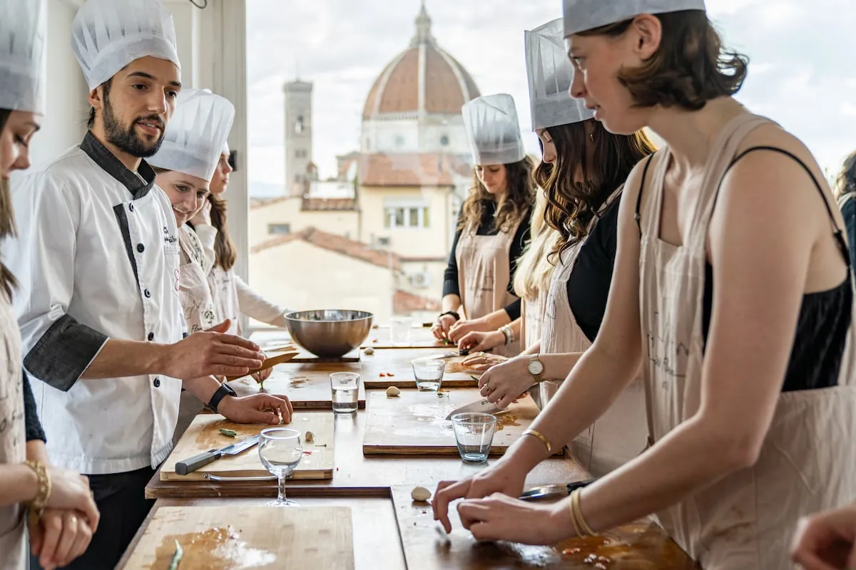 Travelers taking part in a hands-on cooking class in Florence