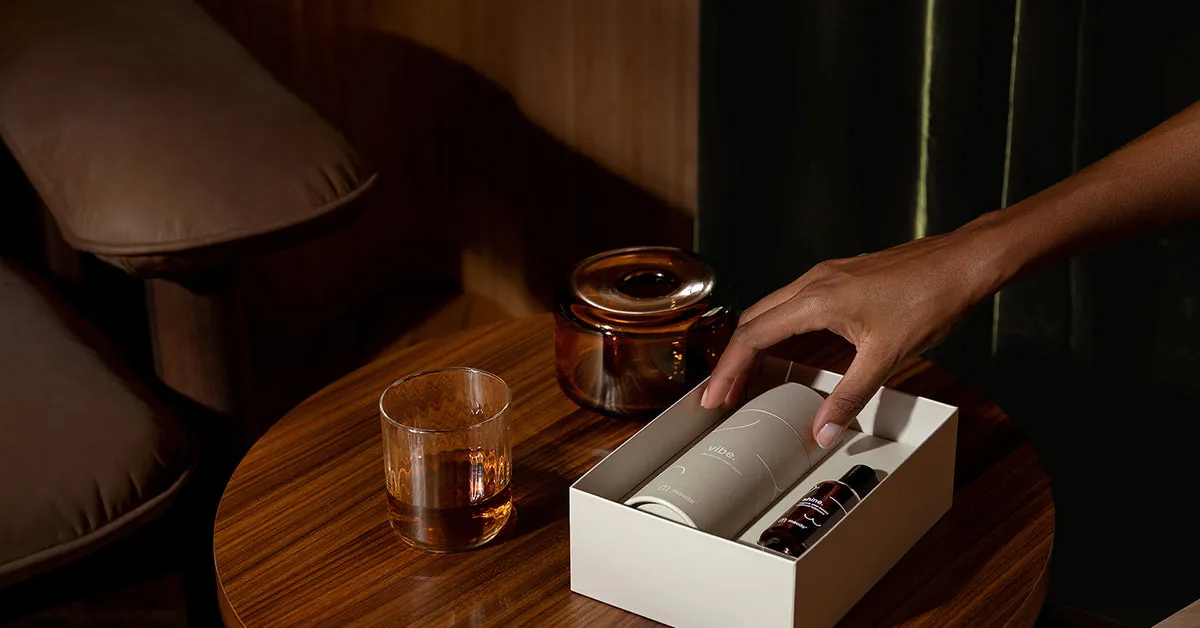 Maude intimate wellness gift set on a wooden table